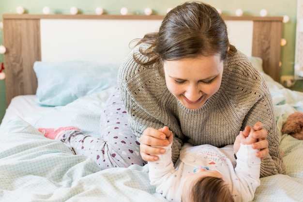 woman playing with her baby